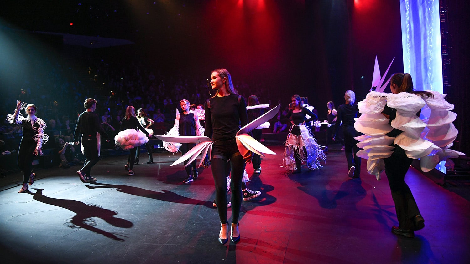 NC State student models and performers on stage during Art2Wear 2023.