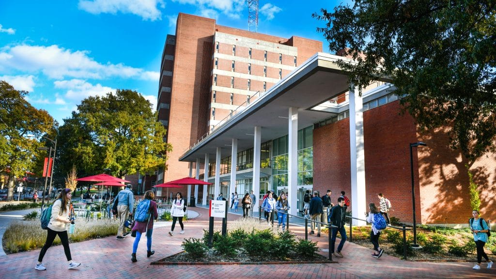 Students come and go in front of the renovated DH Hill Jr. Library entrance on Hillsborough Street on a pleasant November 2019 afternoon.