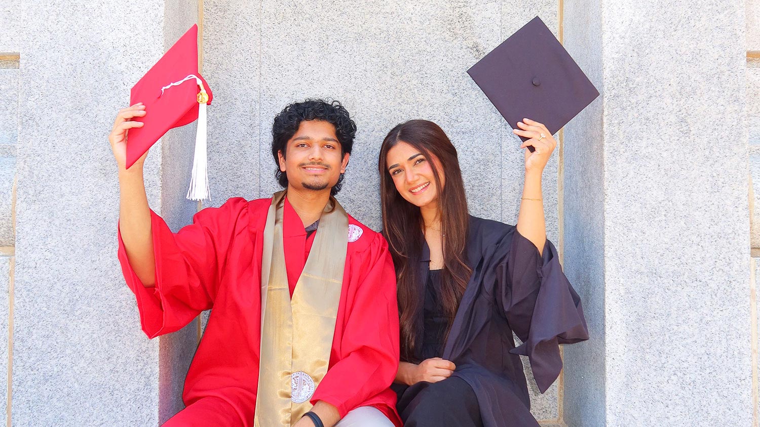 Jannah and Shaan Shakil in their graduation robes.