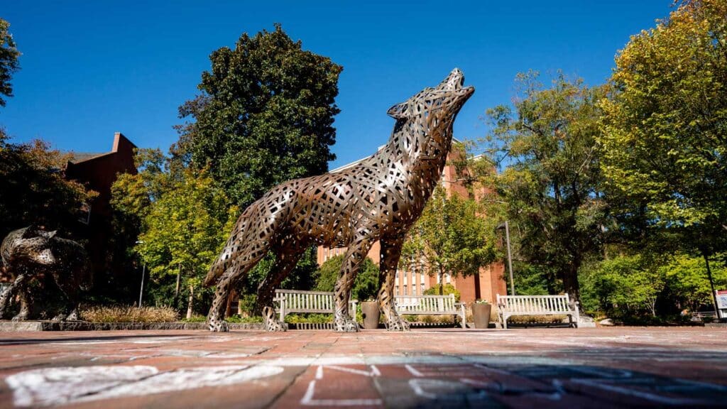 A copper wolf statue in Wolf Plaza.