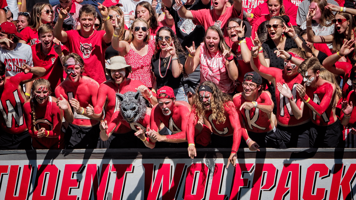 NC State student fans cheer on the Wolfpack during their overtime win over Clemson in 2021.